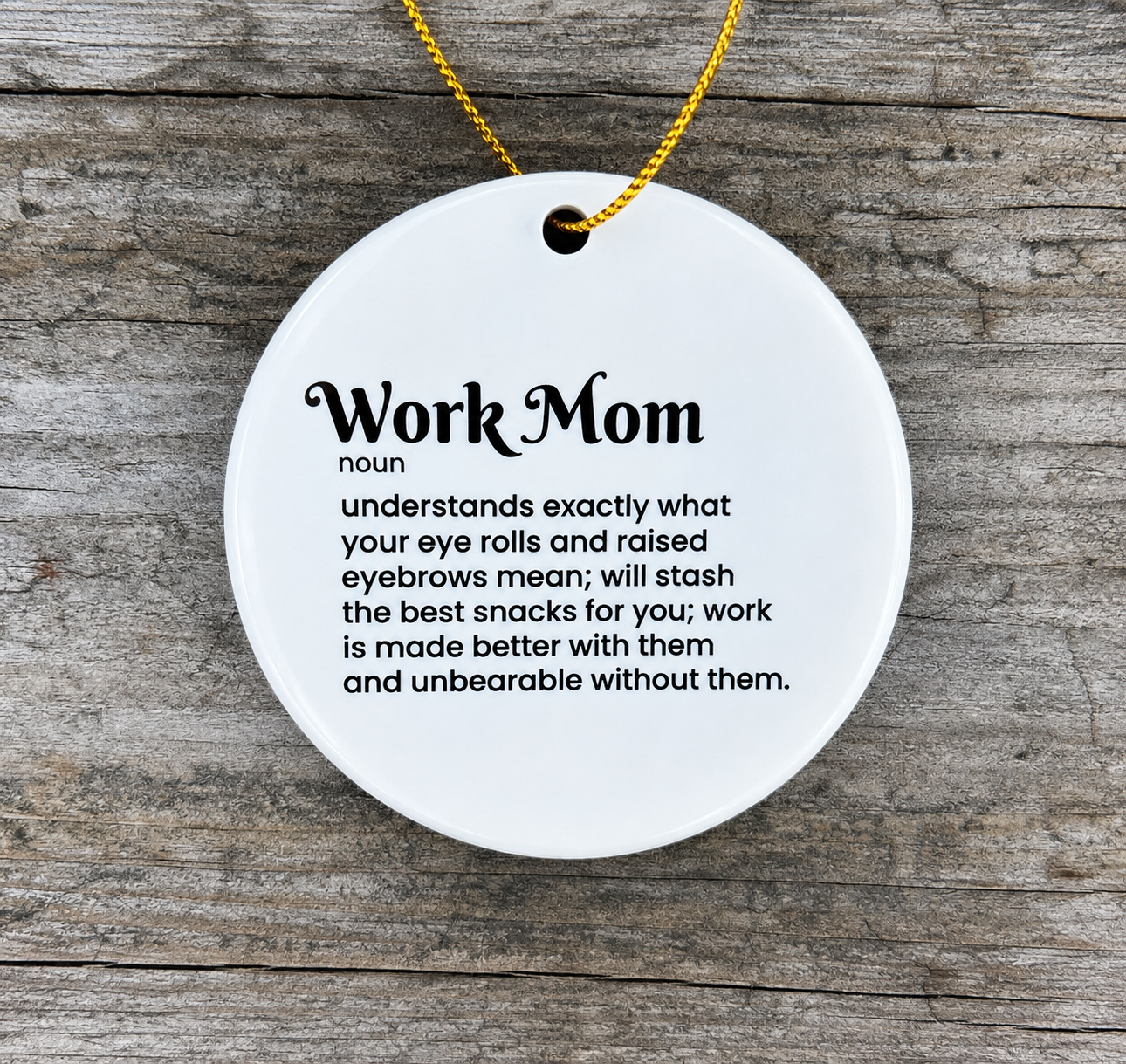 White round ceramic Work Mom ornament with funny definition printed in black and gold hanging cord